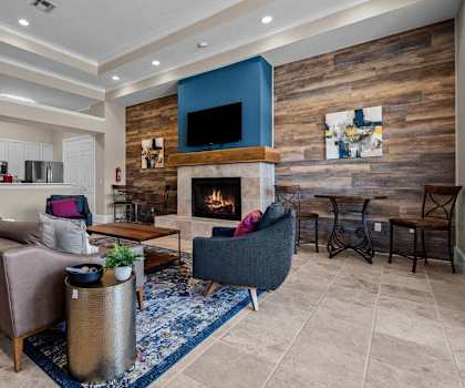 a living room with a couch and a fireplace