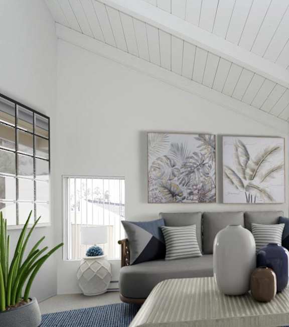 a living room with a couch and a table at The Villas at Monarch Beach, Dana Point, CA