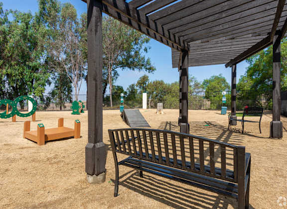 a park bench and a pavilion in a park