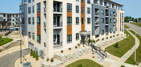 an exterior view of a building with a staircase in front of it at Two Points Crossing, Madison, WI, 53593