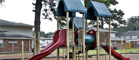 a playground with a slide and other playground equipment