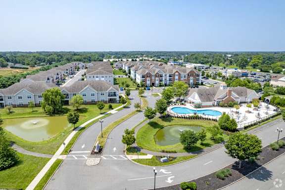 A residential area with a pool and a roundabout.