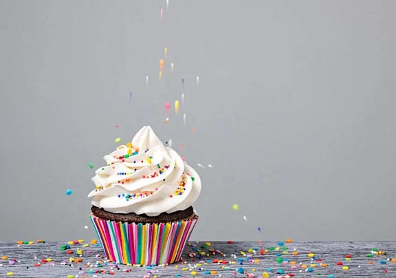 a cupcake with sprinkles