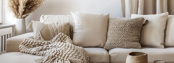 a living room with a couch and pillows on it at Shenandoah Properties in Lafayette, IN 47905
