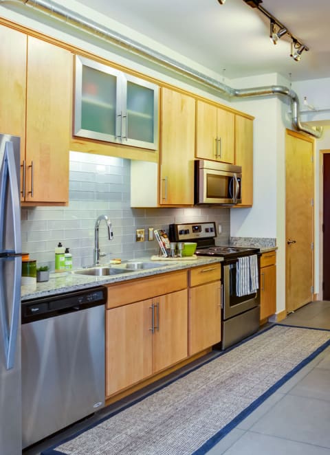 Kitchen with Refrigerator at Arcade Artist Apartments, Missouri