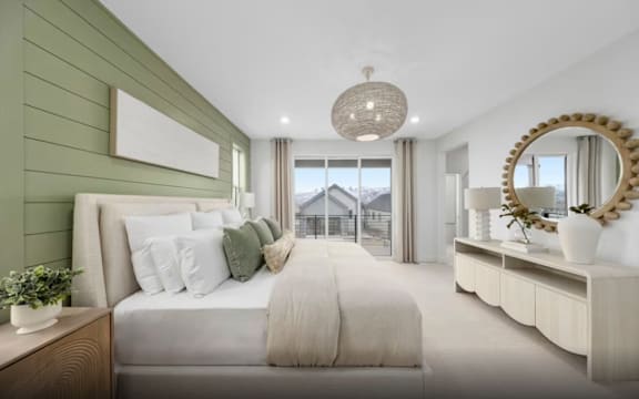 A bedroom with a large bed and a mirror on the wall.