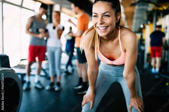 a group of people working out in a gym