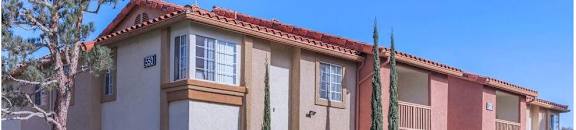 an apartment building with a sidewalk in front of it at Riverview Springs, Oceanside, CA