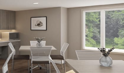 A dining room with a table and chairs. at 35 Broadway Apartments, Menands, New York