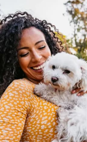 Woman is holding a dog at Jolt Apartments, Nevada