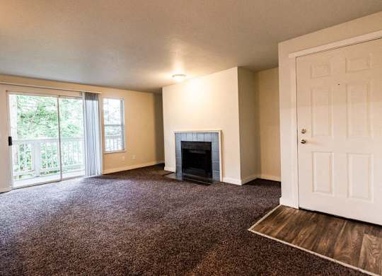 Tacoma Apartments - Sienna Apartments - Living Room, Deck, Fireplace, and Entryway