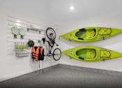 Thumbnail 8 of 9 - A room with two kayaks hanging on the wall and a bicycle hanging from the wall.