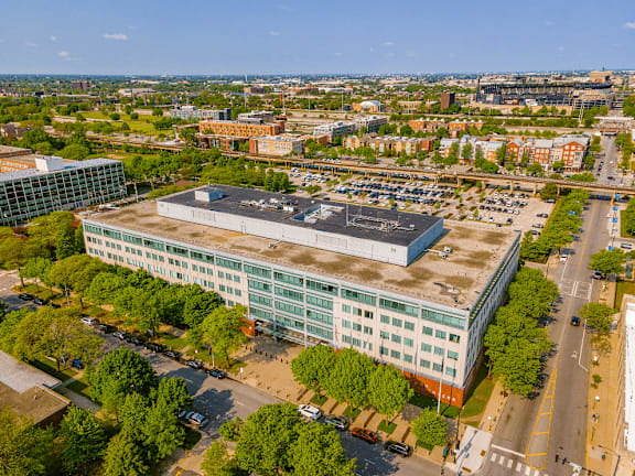 A large building with a parking lot in front of it.