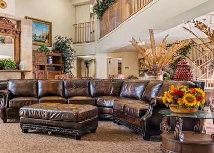 a living room filled with furniture and a fire place