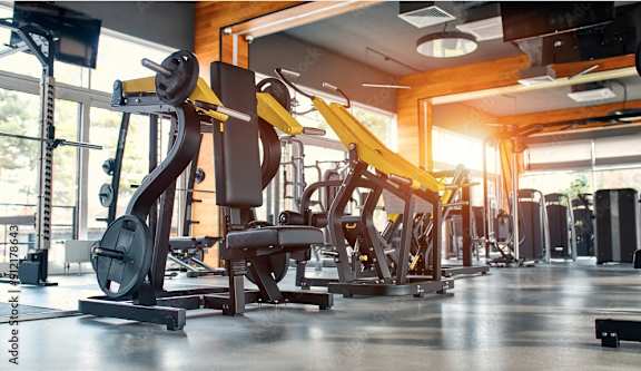 a gym with a bunch of exercise equipment in it