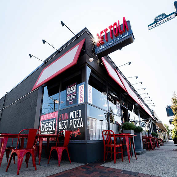 A restaurant named "Metro" has red chairs and tables outside.