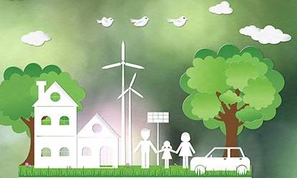 A family is standing in front of a house with a tree and a windmill in the background.