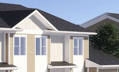 A row of houses with a tree in front of them.