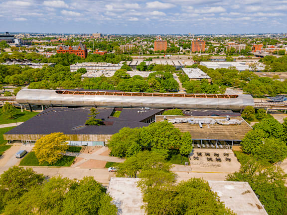 A train station with a train on the tracks.
