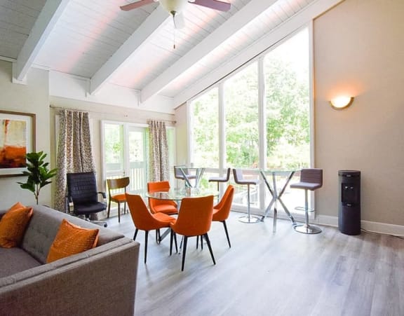 a living room and dining room with a table and chairs at Tucker Square, Stone Mountain, GA, 30083
