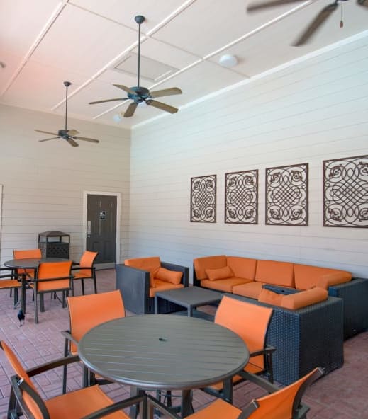 a patio with couches tables and chairs and ceiling fans at The Atlantic McKinney Ranch, McKinney, TX, 75070