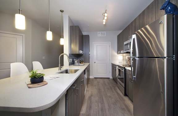 Kitchen with 42" wall cabinets and quartz countertops