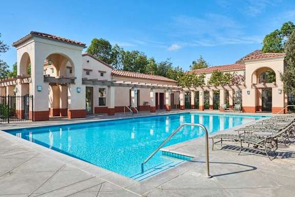 a swimming pool in front of a building with a resort style pool at Mission Hills, California, 93012