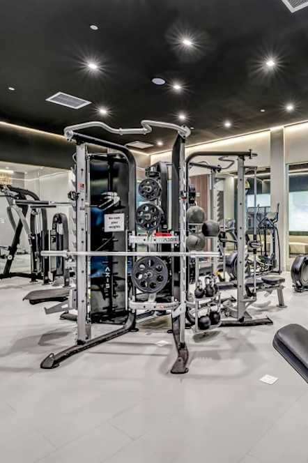 a gym with weights and cardio equipment at the mansion at Up House, Farmington, Connecticut