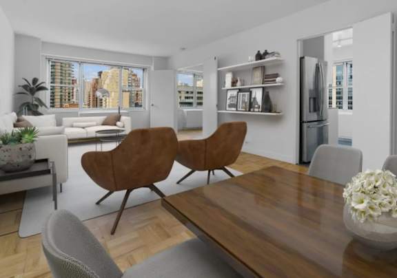 A modern living room with a wooden table and chairs at The Caldwell Apartments, New York, 10028