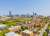 Thumbnail 49 of 59 - A cityscape with a mix of residential and commercial buildings.