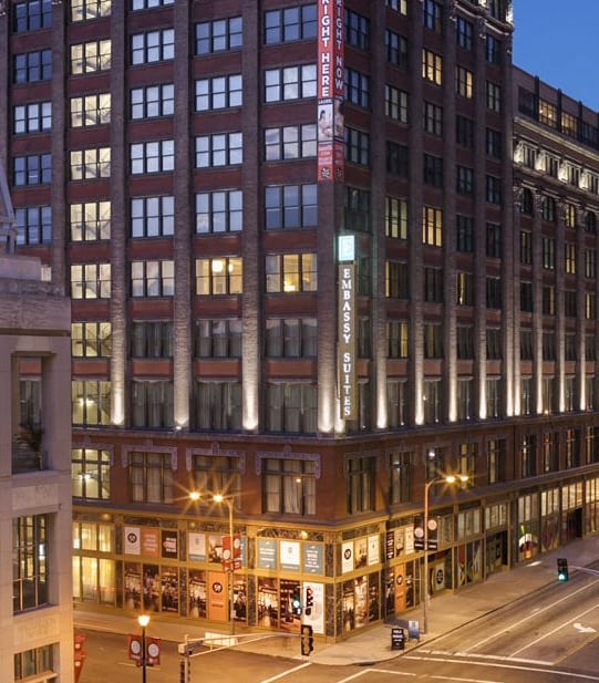 a view of a city street at night with tall buildings at The Laurel Apartments, Saint Louis, Missouri