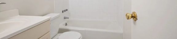 Bright white bathroom with full tub