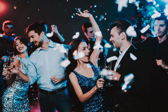 a group of people dancing at a party at The Willard Apartments, Owings Mills Maryland