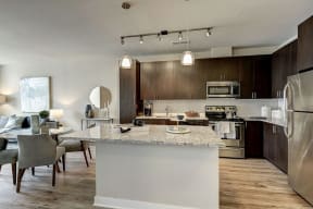 Kitchen and dining area in a unit at Highgate At The Mile in McLean, Virginia