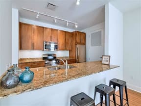 Fitted Kitchen With Island Dining at The Residences on High Street, Phoenix