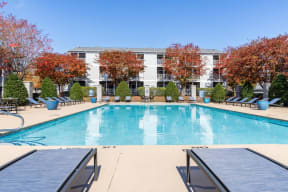 Indigo Apartments Pool with Lounge Chairs