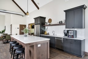 Clubhouse Kitchen with Large Kitchen Island and Bar Stool Seating