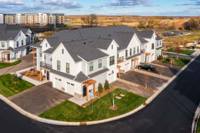 Aerial View Of Apartment Homes With Front Lawns, Private Entrances & Driveways