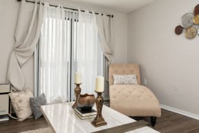 Living Room with Hardwood Style Flooring and Sliding Patio Door with Grey Beige Walls