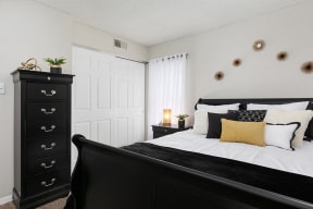 Bedroom with Sliding White Closet Doors