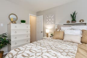 Bedroom with Plush Carpeting and Grey Beige Wall Colors