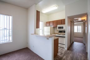Kitchen and living room at Casa Bella Apartments in Tucson AZ 4-2020