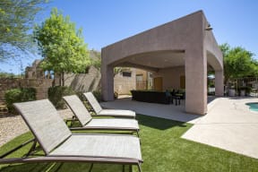 Pool patio long chairs at Avilla Marana in Marana AZ June 2021
