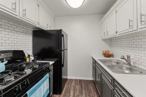 The Preserve at Woodfield Apartments Kitchen with Black Appliances