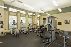 The Grove at Waterford Crossing Apartments Fitness Center with Elliptical, Free Weights, Treadmill, and More