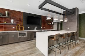 a kitchen with a long island with a white countertop