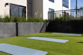 Outdoor fitness turf with yoga mat