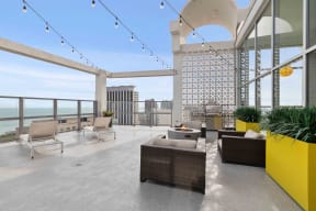 Wave Lakeview Apartments Sun Deck with Fire Pit, Grilling Station, and Lounge Seating, Overlooking the City