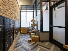 a room with a chevron floor and a whiteboard on the wall