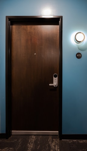 a door with a security camera on the side of it